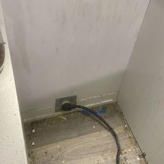 Behind the oven, before cleaning