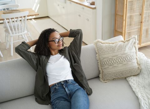 Homeowner relaxing in a freshly cleaned living room, representative of larger Richmond Hill homes we service